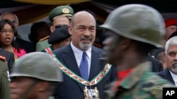 FILE - Then-Surinamese President Desi Bouterse attends a military parade after his swearing-in ceremony in Paramaribo, Suriname, on Aug. 12, 2010.