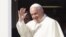 Pope Francis waves to reporters at Rome's Fiumicino international airport, Saturday, Sept. 19, 2015, as he boards his flight to Habana, Cuba, where he will start a 10-day trip including the United States. 