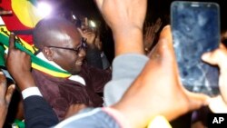 Pastor Evan Mawarire leaves the Harare Magistrates Court, Zimbabwe, July 13, 2016, after the court freed him ruling that police violated his rights. 