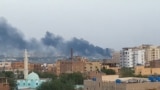 Smoke rises from the tarmac of Khartoum International Airport as a fire burns, in Khartoum, Sudan April 17, 2023 in this screen grab obtained from a social media video. 