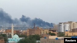 Smoke rises from the tarmac of Khartoum International Airport as a fire burns, in Khartoum, Sudan April 17, 2023 in this screen grab obtained from a social media video. 