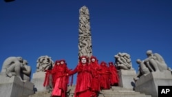 Nordic Rebellion members gather in Vigeland Park, Oslo, Aug. 23, 2021, during a demonstration against oil extraction in Norway. 