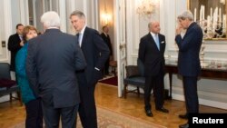 Officials involved in Iran nuclear talks are seen meeting for dinner at the residence of the British ambassador in Vienna November 23, 2014. U.S. Secretary of State John Kerry is at right.