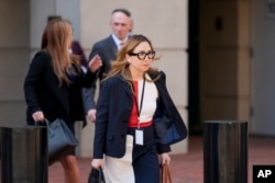 Jeannie Rhee, a lawyer representing Google in the Department of Justice's antitrust case against the tech giant, leaves the U.S. District Court for the Eastern District of Virginia for a break in the trial, Sept. 9, 2024, in Alexandria, Va.