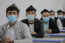 Ethnic minority students attend a class at the Urumqi Islamic Institution during a government-organized trip for foreign journalists in Urumqi on April 22.