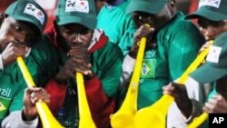 South African fans blow vuvuzelas in support of Brazil at last year's Confederations Cup in South Africa. .Football fans around the world want the instruments banned at the forthcoming World Cup