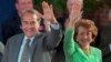 FILE - Then-Republican presidential nominee Bob Dole and his wife Elizabeth wave to well-wishers at a rally in downtown Phoenix, Arizona, Oct. 25, 1996. 