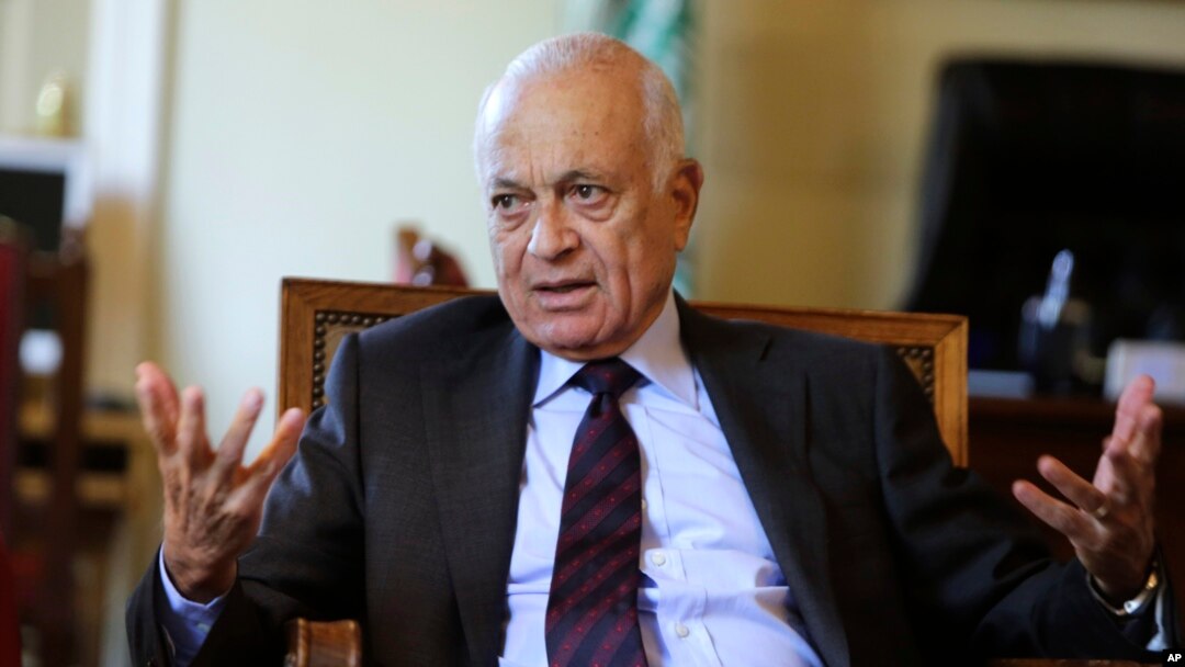 The Arab League's Secretary-General Nabil Elaraby speaks to Nasr al-Hariri, secretary-general of the Syrian National Coalition, Syria's main opposition group, at the League's headquarters in Cairo, Egypt, Sept. 6, 2014. 