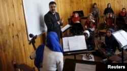 FILE - Ahmad Naser Sarmast, head of Afghanistan's National Institute of Music, speaks to members of the Zohra orchestra, an ensemble of 35 women, in Kabul, Afghanistan, April 4, 2016.