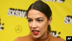Alexandria Ocasio-Cortez arrives for the world premiere of "Knock Down the House" at the Paramount Theatre during the South by Southwest Film Festival, March 10, 2019, in Austin, Texas. 