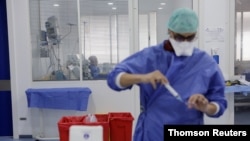 A patient is seen in the Intensive Care Unit at Prince Moulay Abdellah hospital as the spread of COVID-19 continues in Sale, Morocco April 23, 2020.