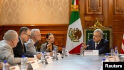 Mexico's President Andres Manuel Lopez Obrador holds a meeting with a delegation of U.S. lawmakers to talk about the United States-Mexico-Canada Agreement trade deal, at National Palace in Mexico City, Mexico July 19, 2019.