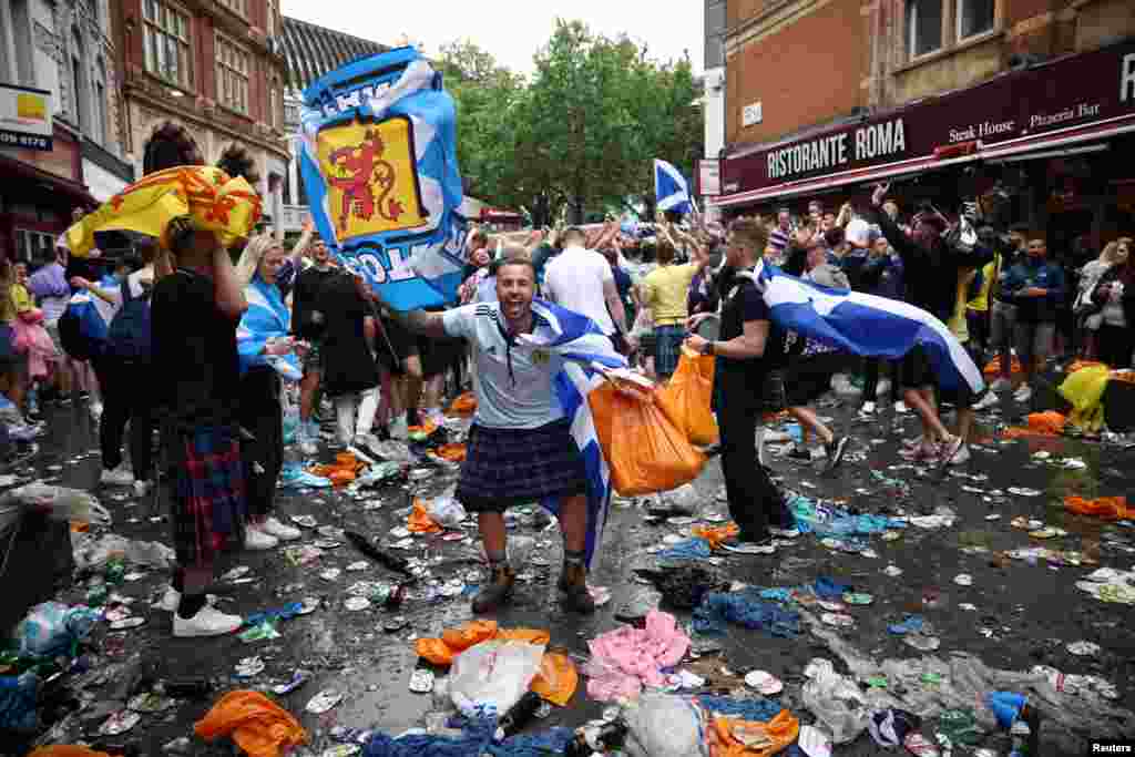 Scotland fans gather in Leicester Square prior to the Euro 2020 soccer championship match between England and Scotland, in London.