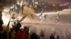 Israeli police use a water cannon to disperse demonstrators blocking a highway during a protest against plans by Prime Minister Benjamin Netanyahu's government to overhaul the judicial system, in Tel Aviv, Israel, March 27, 2023.