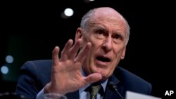 FILE - Director of National Intelligence Dan Coats speaks at a Senate panel hearing on worldwide threats, in Washington, Feb 13, 2018.