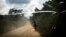Un homme marche sur la route de transport qui relie la ville de Bunia à la ville minière de Mambasa, dans la province de l’Ituri, le 10 juillet 2018.