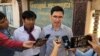 FILE: Uon Chhin and Yeang Sothearin, former RFA reporters talk to reporters outside of appeal court on 23 December, 2019. (Tum Malis/VOA)