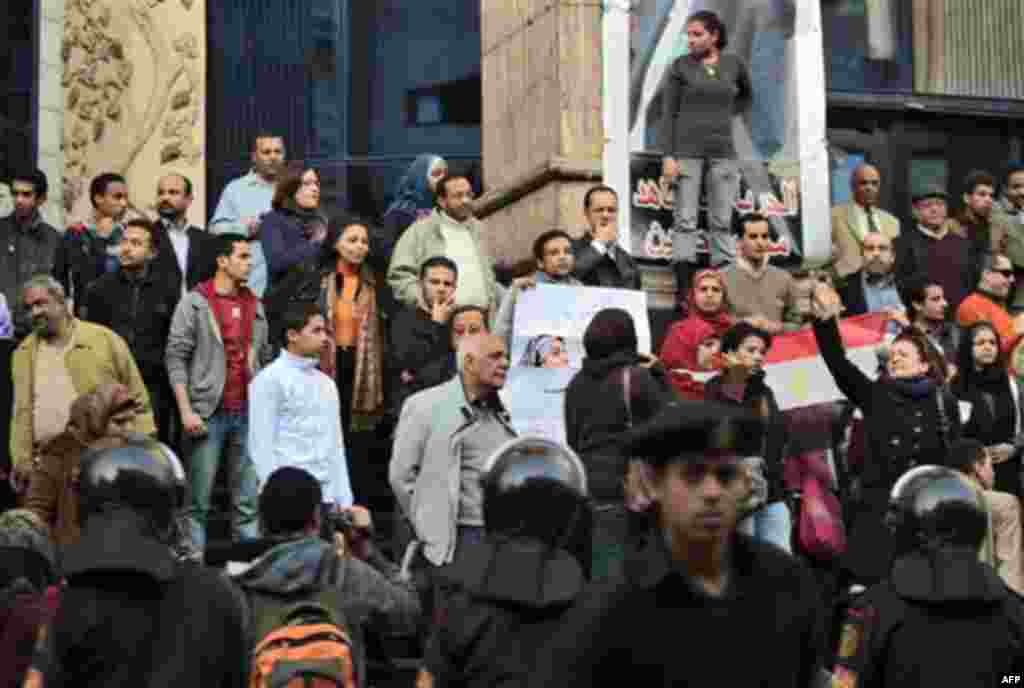 Egyptian anti-government activists chant slogans as they gather outside the Journalists Syndicate in downtown Cairo, Egypt, Thursday, Jan. 27, 2011. Egyptian President Hosni Mubarak's ruling party says it is ready to open a dialogue with the youths who ha