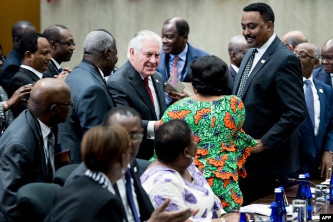 U.S. Secretary of State Rex Tillerson greets participants during a meeting of African leaders at the State Department in Washington, Nov. 17, 2017.