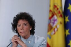 FILE - Spain's Isabel Celaa listens to a question during a news conference after a cabinet meeting at the Moncloa Palace in Madrid, Spain, June 8, 2018.