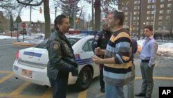 Baltimore police office Ken Dickstein, who also acts as the special Jewish Liaison, chats with some Jewish Americans in the community, March 2011