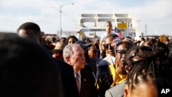 Democratic presidential candidate Mike Bloomberg, walks across the Edmund PettBridge in Selma, Ala., March 1, 2020, to commemorate the 55th anniversary of "Bloody Sunday," when white police attacked black marchers in Selma.
