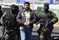 FILE - Alleged drugdealer Alfredo Beltran Leyva is showed to the media by members of the Mexican Army in Mexico City, on January 21, 2008, after being captured in Culiacan, in the northwestern state of Sinaloa, along with three other members of his gang.