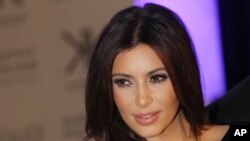 FILE - Kim Kardashian arrives for their Kardashian Kollection UK Launch at Acqua Club in central London, Nov. 8, 2012. 
