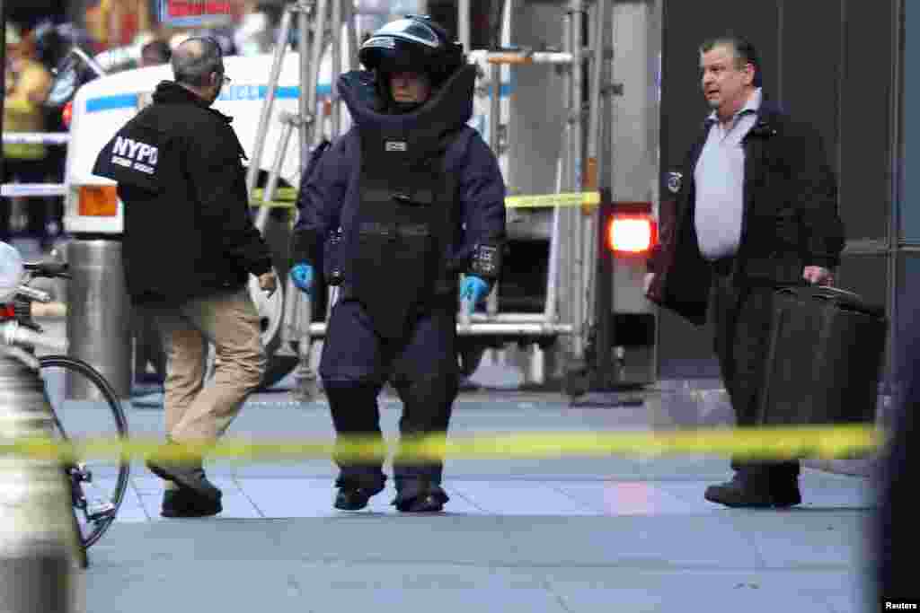 A member of the New York Police Department bomb squad is seen outside the Time Warner Center in New York City after a suspicious package was found inside the offices where CNN has studios.