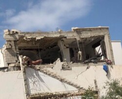 An apartment building after a bombing, March 27, 2020, in Tripoli. (Courtesy of resident Mohammed Kikly)