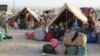 FILE - Afghan refugees rest in tents at a makeshift shelter camp in Chaman, a Pakistani town on the border with Afghanistan, Aug. 31, 2021.