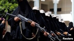 FILE - To show their support for the Houthi movement, women participate in a parade in Sana'a, Yemen, Sept. 7, 2016. Western and Iranian officials note an increase in the flow of arms to the Iran-backed rebels.