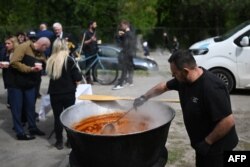 FILE—A volunteer prepares a soup, as usually provided by the US-based food charity World Central Kitchen, at the funeral of Damian Sobol, a member of that charity, killed in an Israeli strike in Gaza, at his home town of Przemysl, Poland on April 20, 2024.