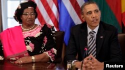 U.S. President Barack Obama (R) talks to the media next to President Joyce Banda of Malawi after his meeting with African leaders at the White House in Washington, March 28, 2013