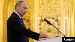 Russian President Vladimir Putin takes the oath during an inauguration ceremony at the Kremlin in Moscow, May 7, 2018. (Sputnik/Aleksey Nikolskyi/Kremlin via Reuters)