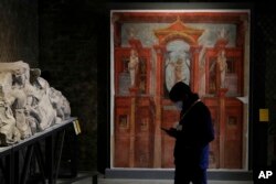 Archeological findings are displayed at the museum Antiquarium in Pompeii, southern Italy, Monday, Jan. 25, 2021. (AP Photo/Gregorio Borgia)