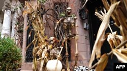 Skeletons are part of a Halloween display in front of an Upper East Side home on Oct. 30, 2020, in New York City. 