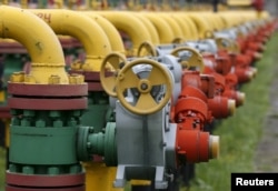 FILE - Pipes and valves are seen at an underground gas storage facility near Striy, Ukraine.