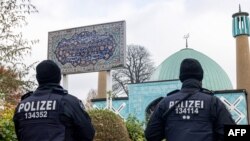 FILE —Police officers are pictured during the search of the "Blue Mosque", housing the Islamic Centre of Hamburg, during raids accross Germany over suspected links to the Iran-backed Hezbollah group in Hamburg, northern Germany on November 16, 2023, as authorit