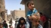 Iraqi civilians flee fighting against Islamic State militants in the Old City of Mosul, Iraq, July 1, 2017.