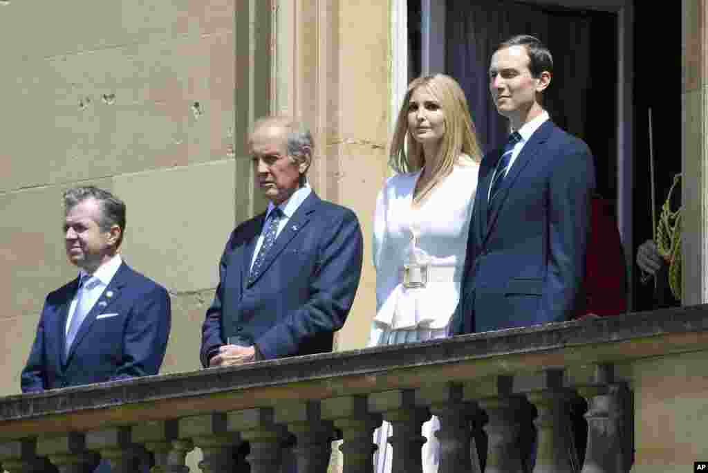 Jared Kushner, right, and Ivanka Trump, second right, attend a welcome ceremony for President Donald Trump and first lady Melania Trump, in the garden of Buckingham Palace, June 3, 2019.
