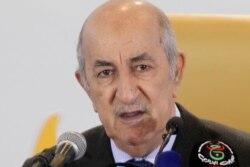 FILE - Algerian President Abdelmadjid Tebboune speaks during a press conference, Dec.13, 2019, in Algiers.