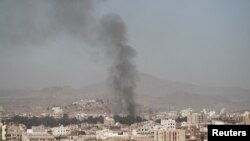 FILE - Smoke rises after an airstrike in Sanaa, Yemen, Dec. 15, 2017. 
