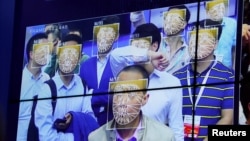 Visitors experience facial recognition technology at Face++ booth during the China Public Security Expo in Shenzhen, China, Oct. 30, 2017. 