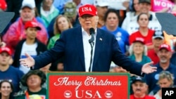 FILE - President-elect Donald Trump speaks during a rally at the Ladd–Peebles Stadium, Dec. 17, 2016.