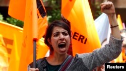 FILE - A protester shouts slogans against Turkey's Prime Minister Recep Tayyip Erdogan and his government's policy on Syria, during a demonstration in Ankara, May 18, 2013.