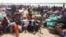 People displaced from fighting between the South Sudanese army and rebels, wait for boats to cross the Nile River, in Bor, around 180 km (112 miles), northwest from the capital of Juba, Dec. 30, 2013. 
