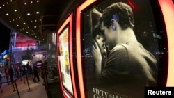 A film poster for "Fifty Shades of Grey" is pictured at Regal Theater in Los Angeles, California, Feb. 12, 2015. 