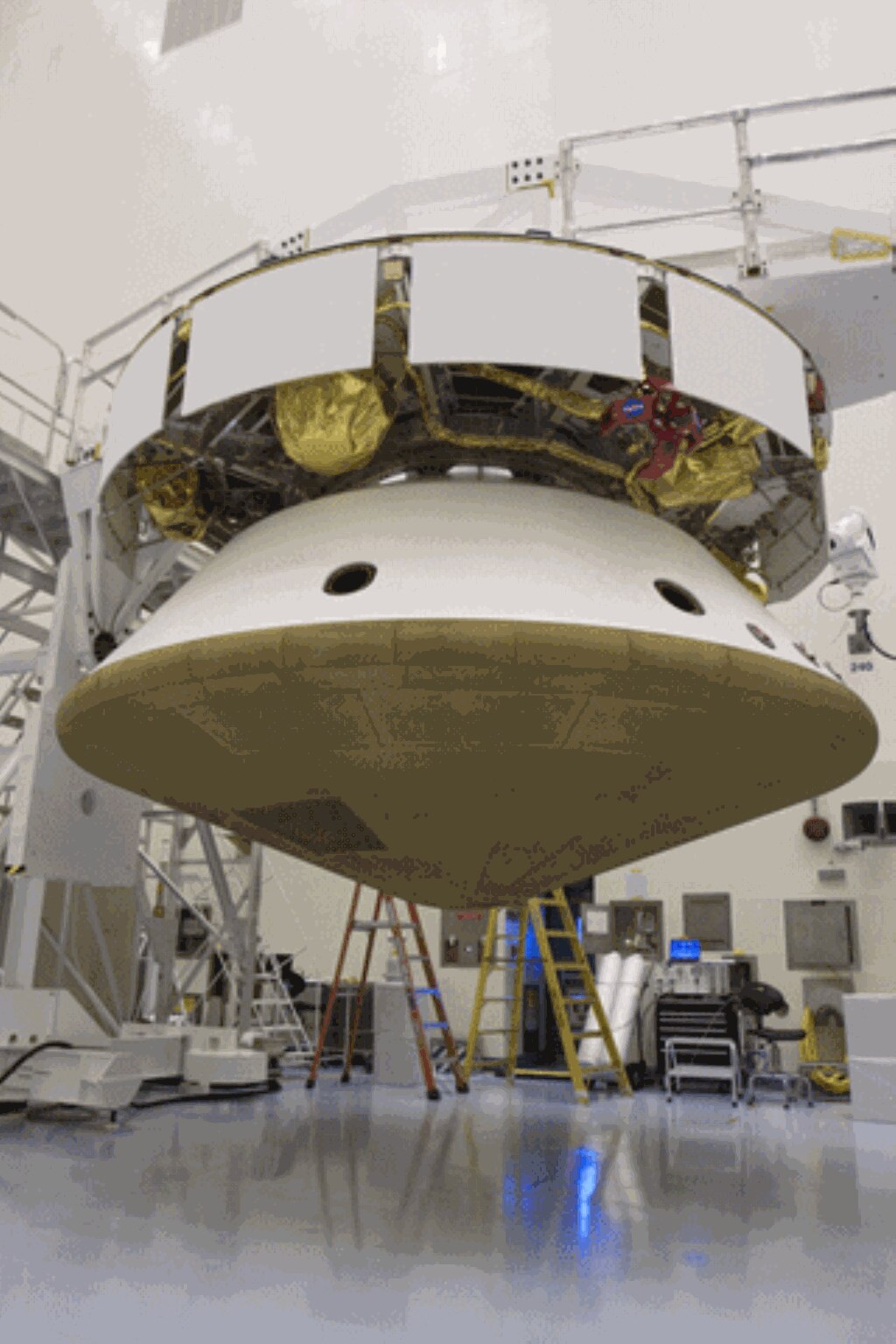 All elements of NASA's Mars Science Laboratory (MSL) mission have come together. The top portion is the cruise stage, next, the aeroshell, (containing the compact car-sized rover Curiosity), and on the bottom, the heat shield. (NASA/Glenn Benson)