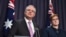 Australian Prime Minister Scott Morrison, left, speaks to the media alongside Foreign Minister Marise Payne during a press conference at the Parliament House in Canberra, Oct. 16, 2018.